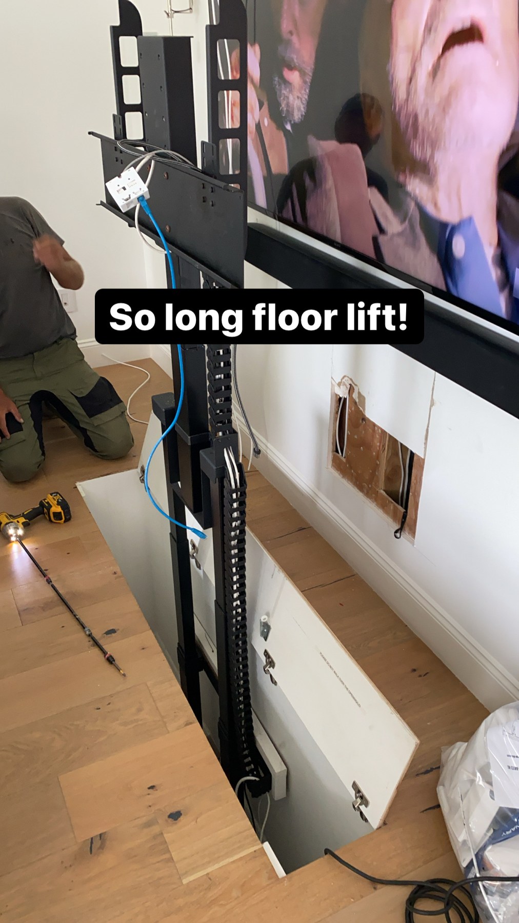 Original floor-mounted TV lift during its removal